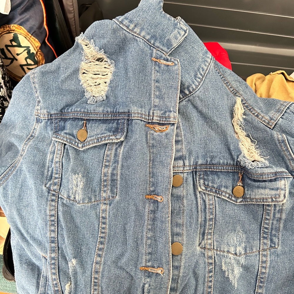 Fashion Nova Jean jacket. Ripped up stylishly